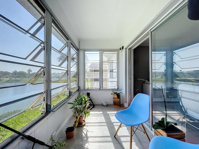 sunroom with a water view