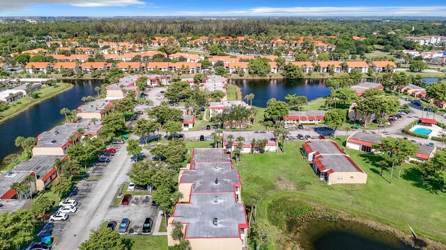 aerial perspective of suburban area with a large body of water