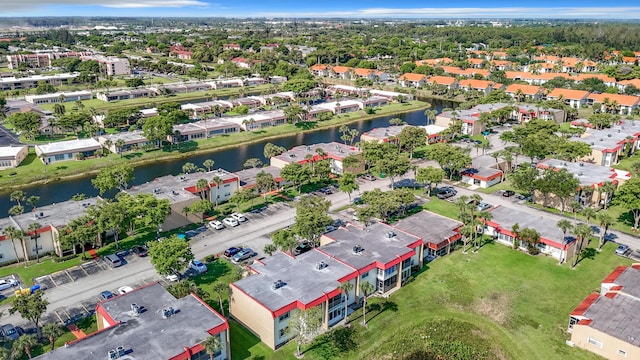 aerial perspective of suburban area featuring a nearby body of water