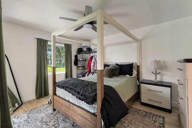 320 Norwood Ter Unit N114, Boca Raton, FL 33431 - bedroom featuring light wood-style floors, a ceiling fan, and baseboards