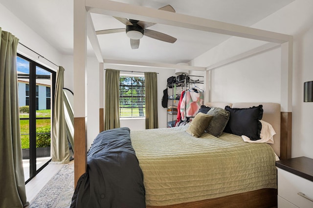 320 Norwood Ter Unit N114, Boca Raton, FL 33431 - bedroom featuring wood finished floors, access to exterior, and ceiling fan