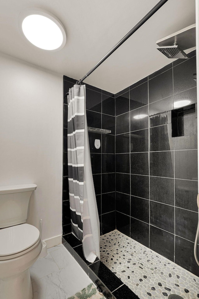 320 Norwood Ter Unit N114, Boca Raton, FL 33431 - full bathroom with a stall shower, toilet, marble finish floors, and baseboards