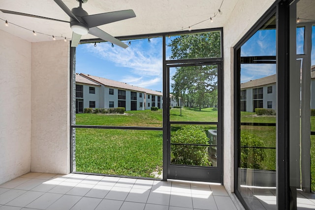 320 Norwood Ter Unit N114, Boca Raton, FL 33431 - unfurnished sunroom featuring healthy amount of natural light and track lighting