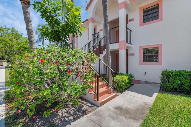320 Norwood Ter Unit N114, Boca Raton, FL 33431 - view of exterior entry featuring stucco siding
