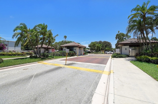 320 Norwood Ter Unit N114, Boca Raton, FL 33431 - view of asphalt street with curbs, traffic signs, and sidewalks