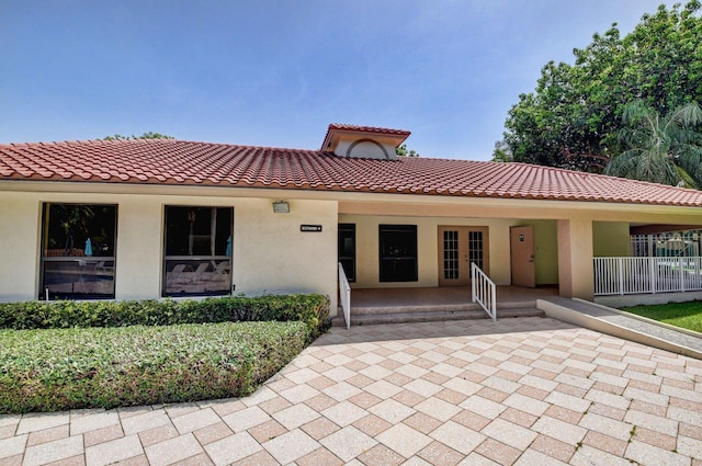 320 Norwood Ter Unit N114, Boca Raton, FL 33431 - view of front of home with stucco siding and a tiled roof