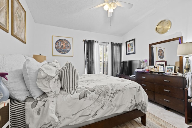 3646 English D Rd Unit D, Lake Worth, FL 33467 - bedroom with lofted ceiling, a ceiling fan, light tile patterned flooring, and a textured ceiling