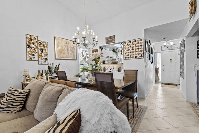 3646 English D Rd Unit D, Lake Worth, FL 33467 - dining area featuring a chandelier, light tile patterned floors, a textured ceiling, and a high ceiling