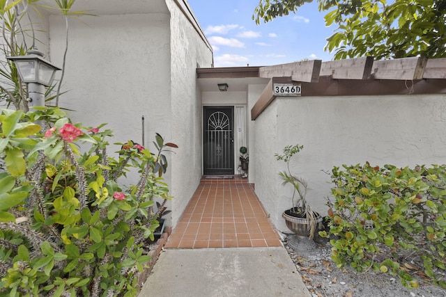 3646 English D Rd Unit D, Lake Worth, FL 33467 - doorway to property featuring stucco siding