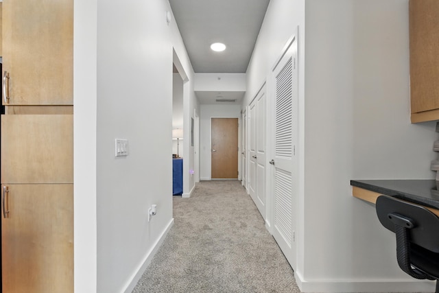 300 S Australian Ave Unit 801, West Palm Beach, FL 33401 - corridor featuring carpet floors, a desk, and baseboards