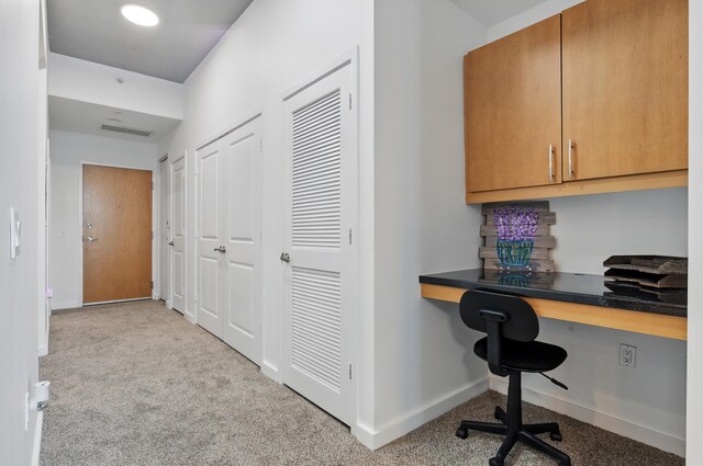 300 S Australian Ave Unit 801, West Palm Beach, FL 33401 - hallway featuring carpet flooring, baseboards, and an office area