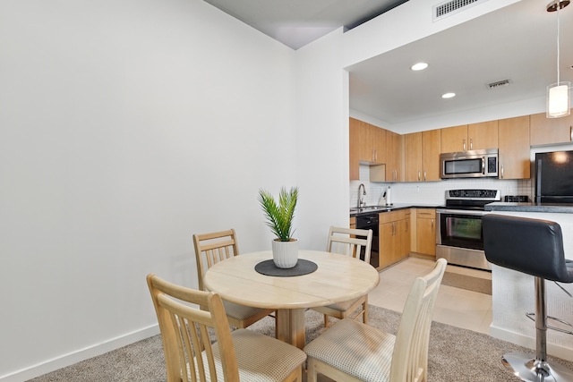 300 S Australian Ave Unit 801, West Palm Beach, FL 33401 - kitchen featuring black appliances, a sink, decorative backsplash, baseboards, and recessed lighting