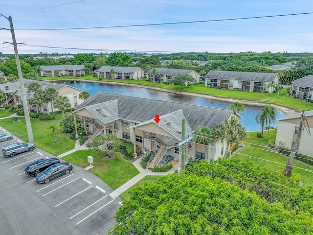 aerial view of residential area featuring a nearby body of water