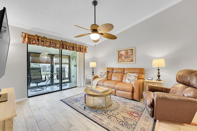 living area featuring crown molding, a ceiling fan, vaulted ceiling, light wood-type flooring, and a textured ceiling