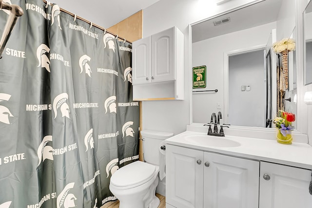 bathroom with vanity and toilet