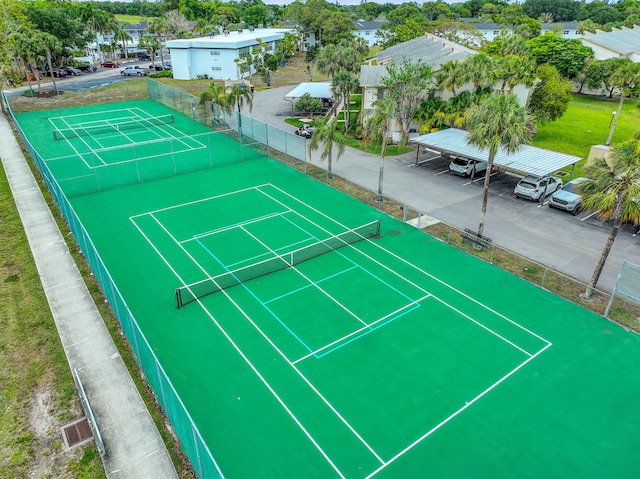 view of tennis court with fence