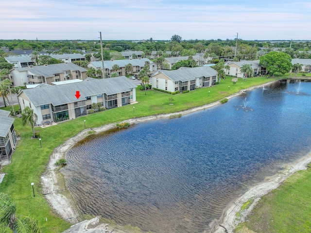 aerial perspective of suburban area with a nearby body of water