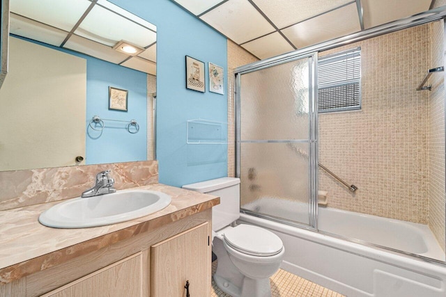 full bath featuring toilet, vanity, enclosed tub / shower combo, and tile patterned floors
