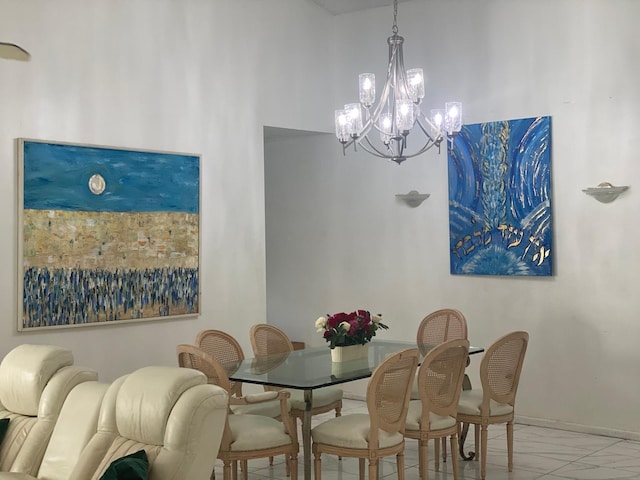 7514 Sierra Dr E, Boca Raton, FL 33433 - dining space featuring a chandelier, marble look tiles, and baseboards