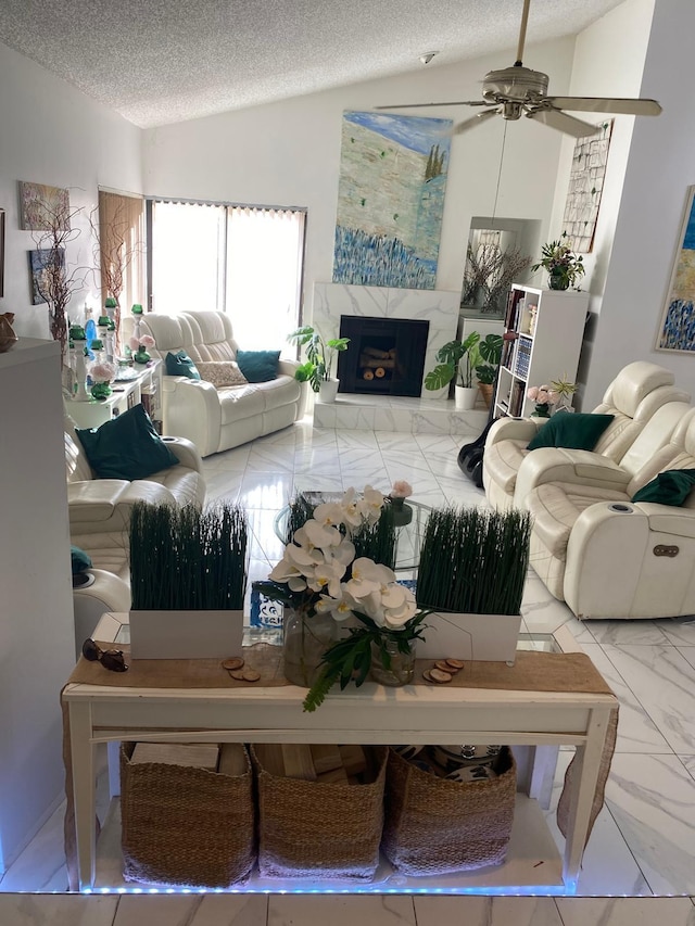 7514 Sierra Dr E, Boca Raton, FL 33433 - living area featuring marble finish floors, a textured ceiling, a fireplace, a ceiling fan, and vaulted ceiling