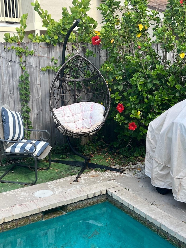 7514 Sierra Dr E, Boca Raton, FL 33433 - view of swimming pool featuring fence