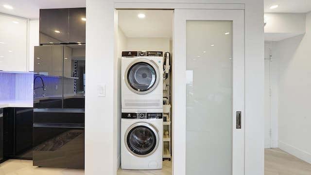 5100 Dupont Blvd Unit 7E, Fort Lauderdale, FL 33308 - laundry area with stacked washing machine and dryer and recessed lighting