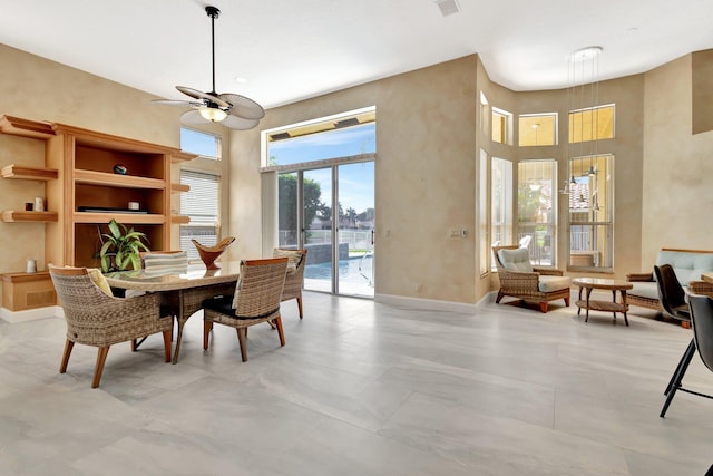 19236 Bay Leaf Ct, Boca Raton, FL 33498 - dining space with a towering ceiling, ceiling fan, and baseboards