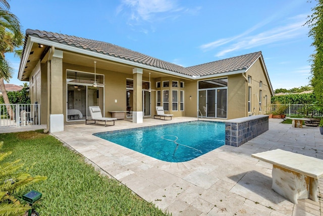 19236 Bay Leaf Ct, Boca Raton, FL 33498 - rear view of house featuring a tile roof, a patio area, stucco siding, and fence