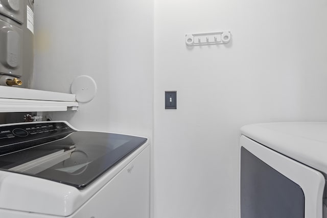 clothes washing area with washer and dryer