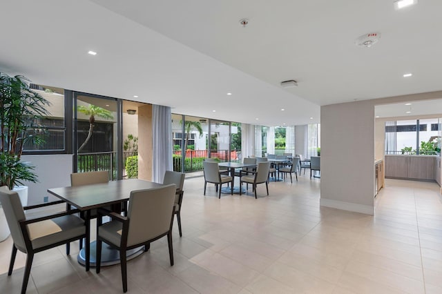 dining space featuring plenty of natural light, recessed lighting, and baseboards