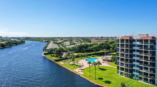 bird's eye view of a nearby body of water and a pool area