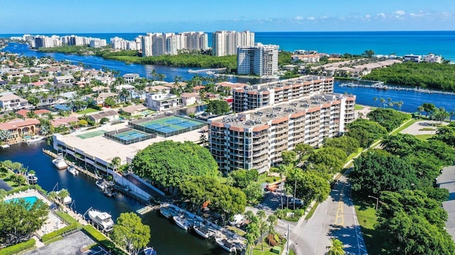 drone / aerial view of a large body of water and apartment complex