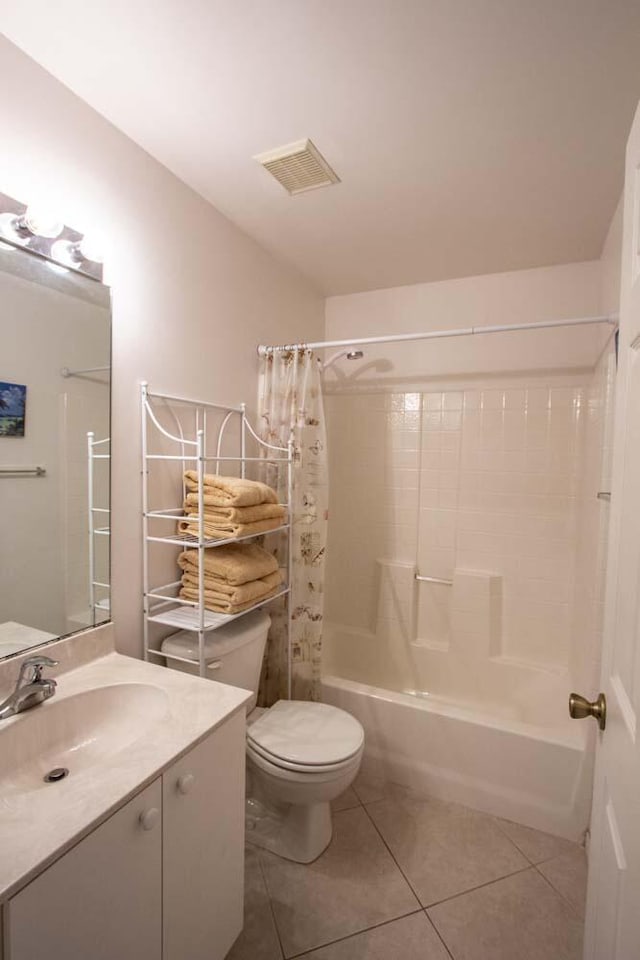 full bath with tile patterned flooring, toilet, shower / tub combo with curtain, and vanity