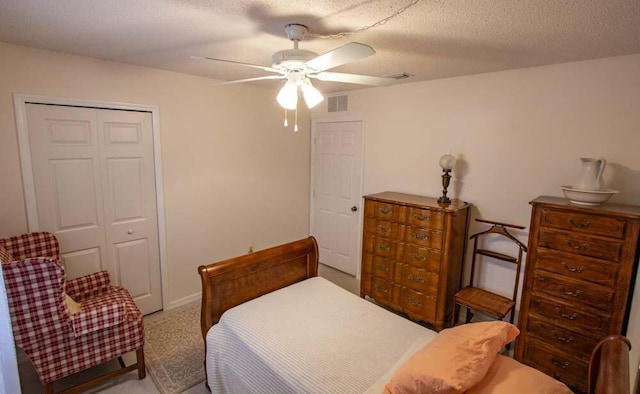 bedroom featuring a closet, ceiling fan, and carpet floors