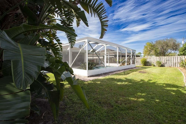 view of yard featuring a lanai