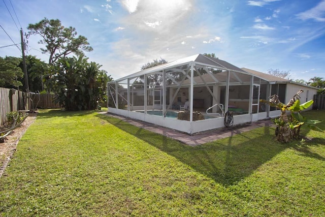 back of property featuring glass enclosure