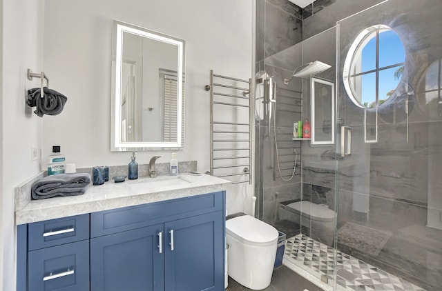 bathroom featuring toilet, a stall shower, and vanity