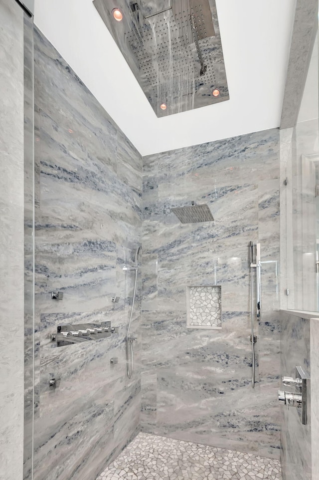 full bath featuring a marble finish shower