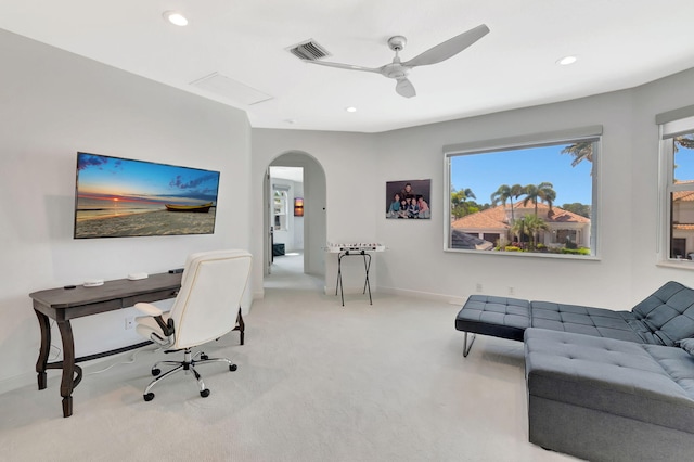 office featuring carpet floors, arched walkways, a ceiling fan, recessed lighting, and baseboards