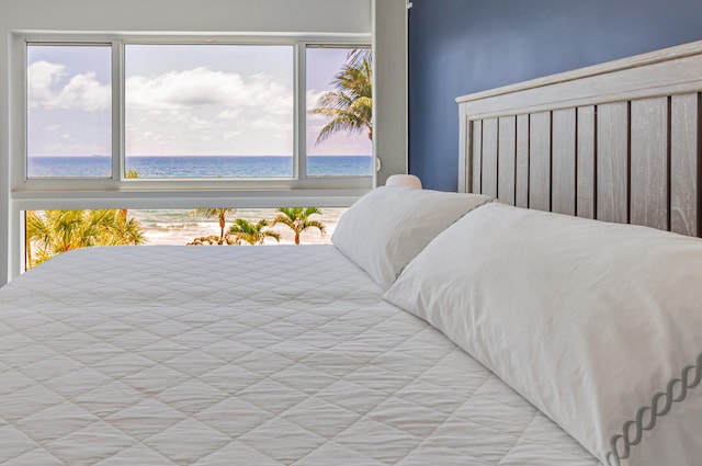 bedroom featuring a water view