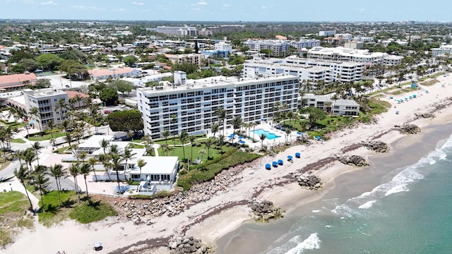bird's eye view of unending shoreline and a pool area