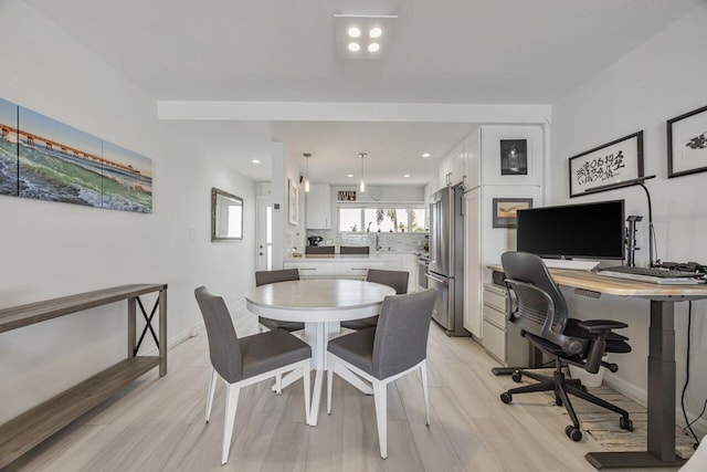 dining area with a desk, light wood finished floors, baseboards, and recessed lighting