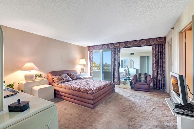 bedroom featuring carpet floors, a textured ceiling, access to outside, and a fireplace