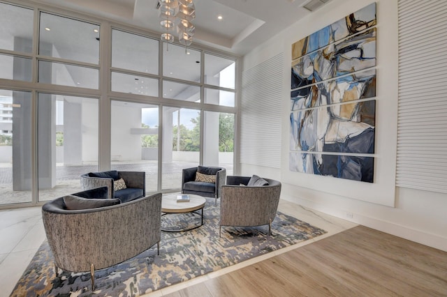 community lobby featuring a high ceiling and recessed lighting