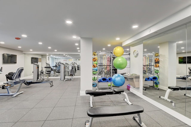 workout area with recessed lighting and baseboards