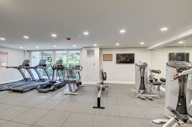workout area with recessed lighting and baseboards