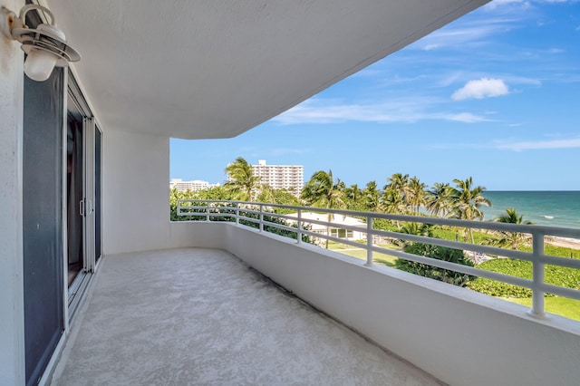 balcony featuring a water view
