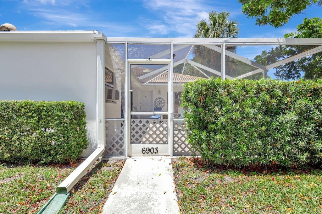 doorway to property with stucco siding