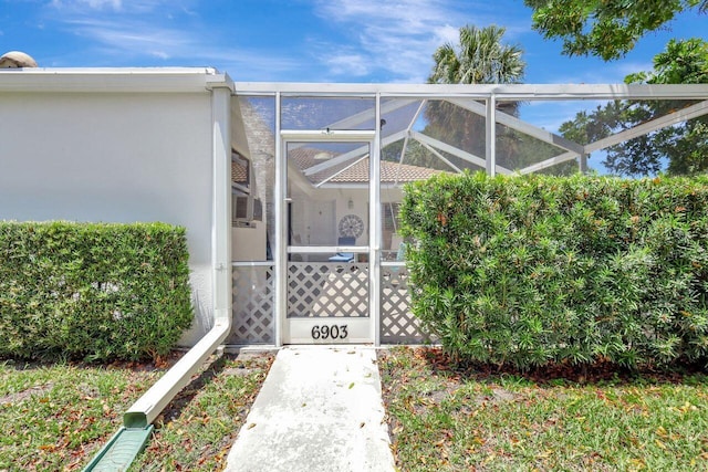 doorway to property with stucco siding