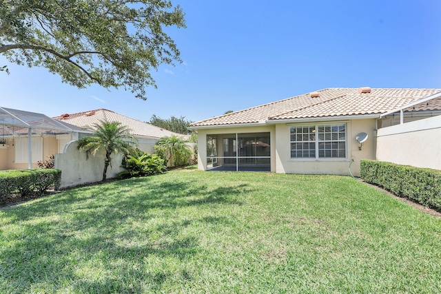 7720 Pine Island Way, West Palm Beach, FL 33411 - back of property featuring stucco siding, a tile roof, and a sunroom